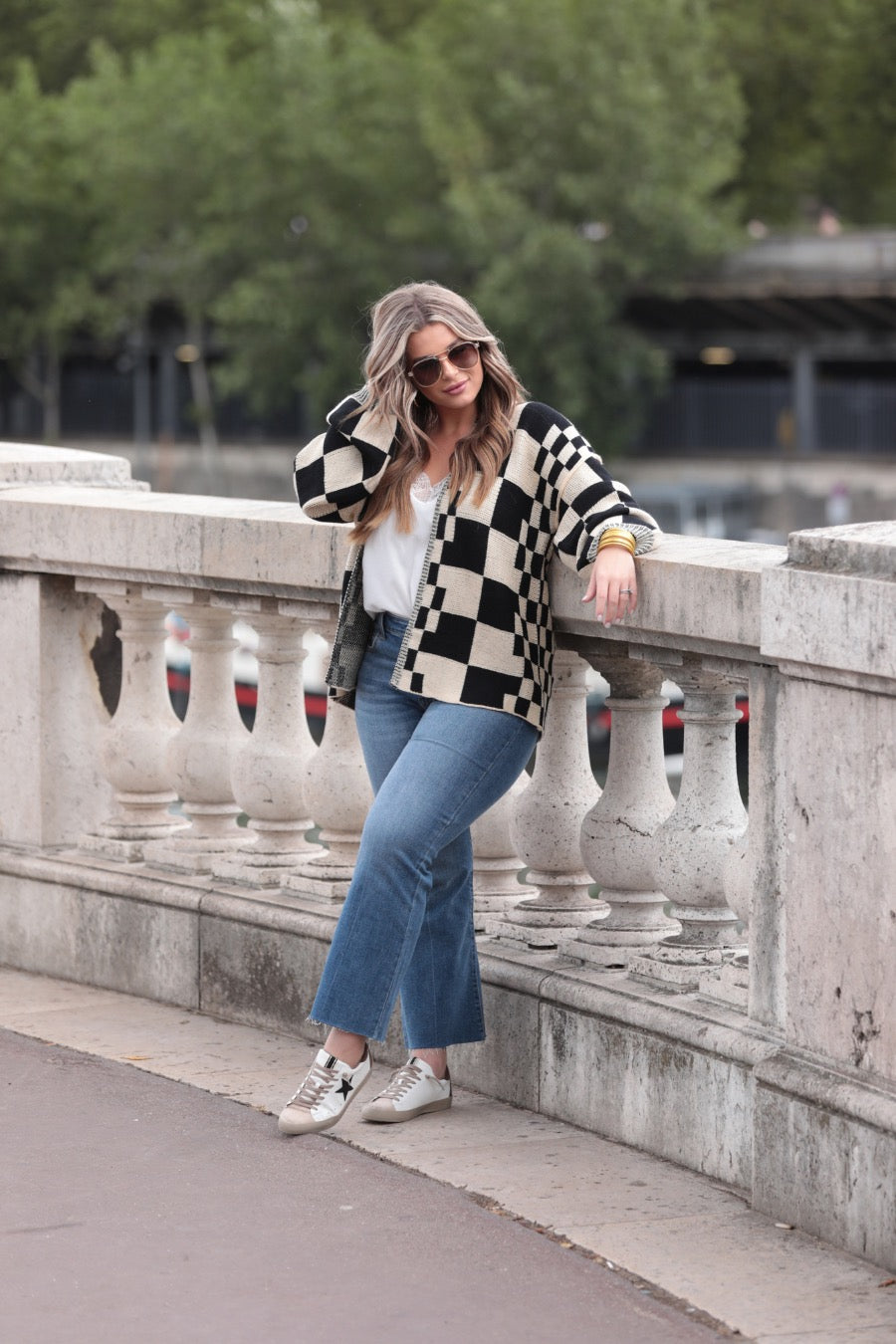 long-sleeve open front cardigan with balloon sleeves and a checkered pattern in tan/black