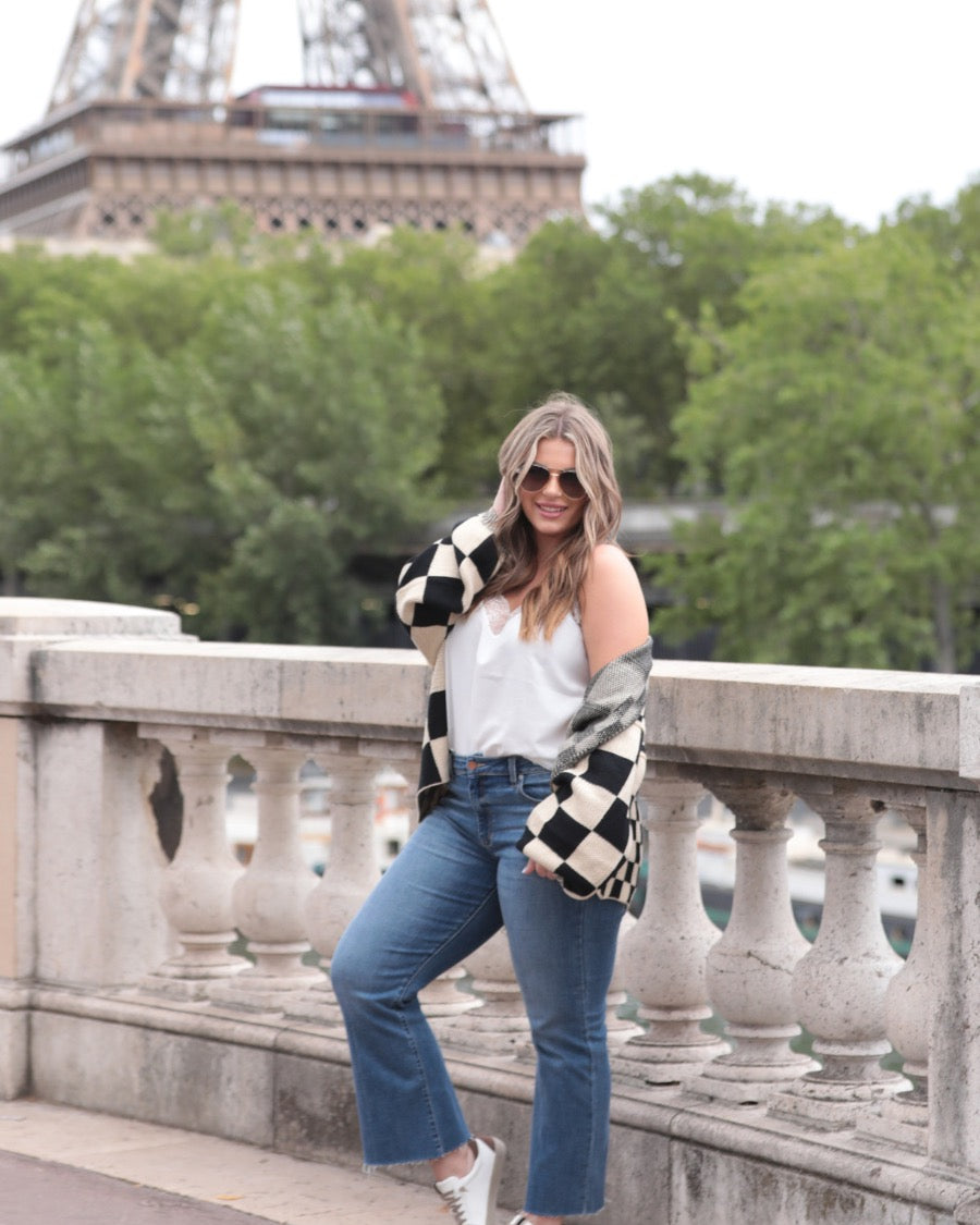long-sleeve open front cardigan with balloon sleeves and a checkered pattern in tan/black