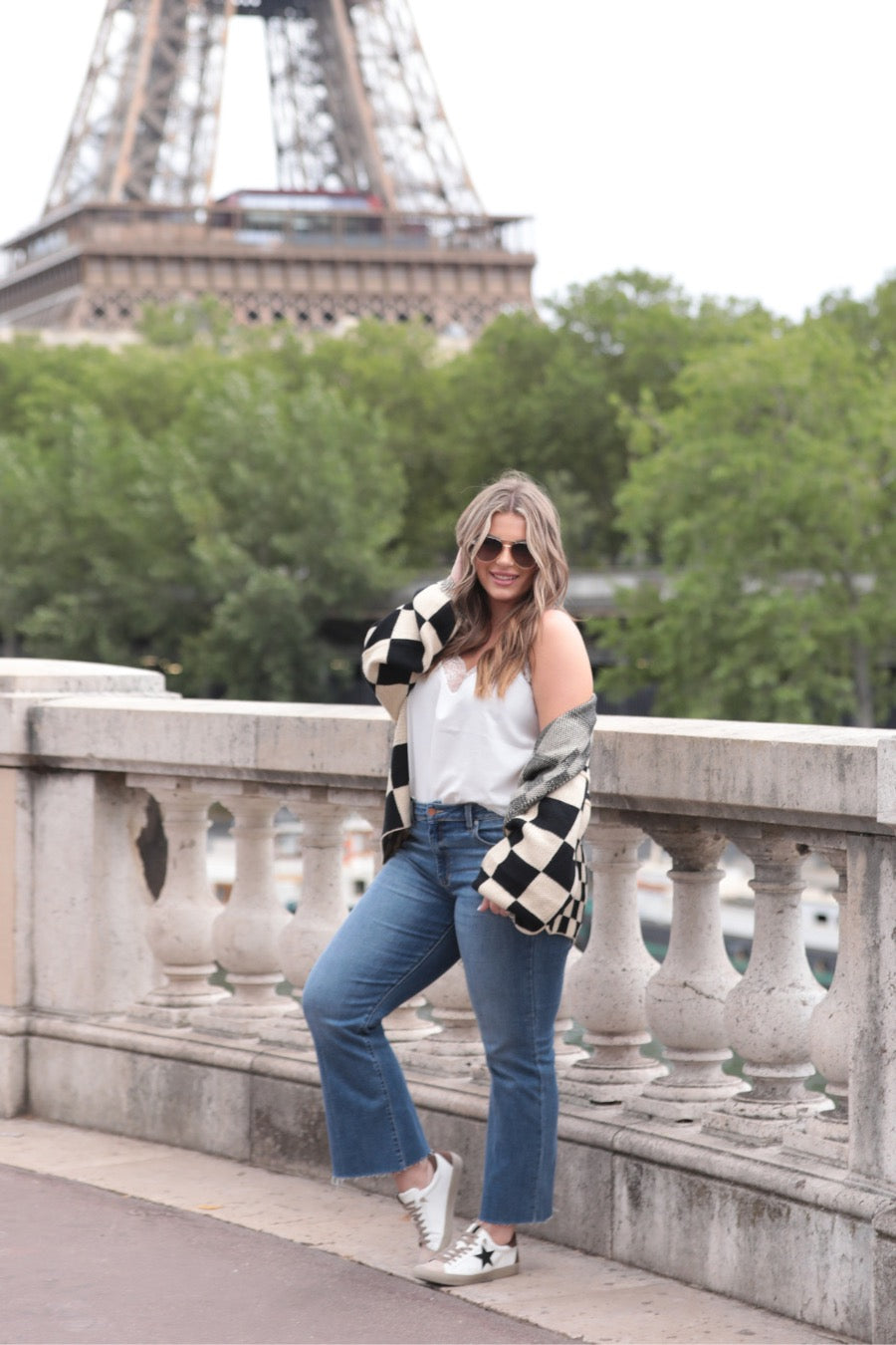 long-sleeve open front cardigan with balloon sleeves and a checkered pattern in tan/black
