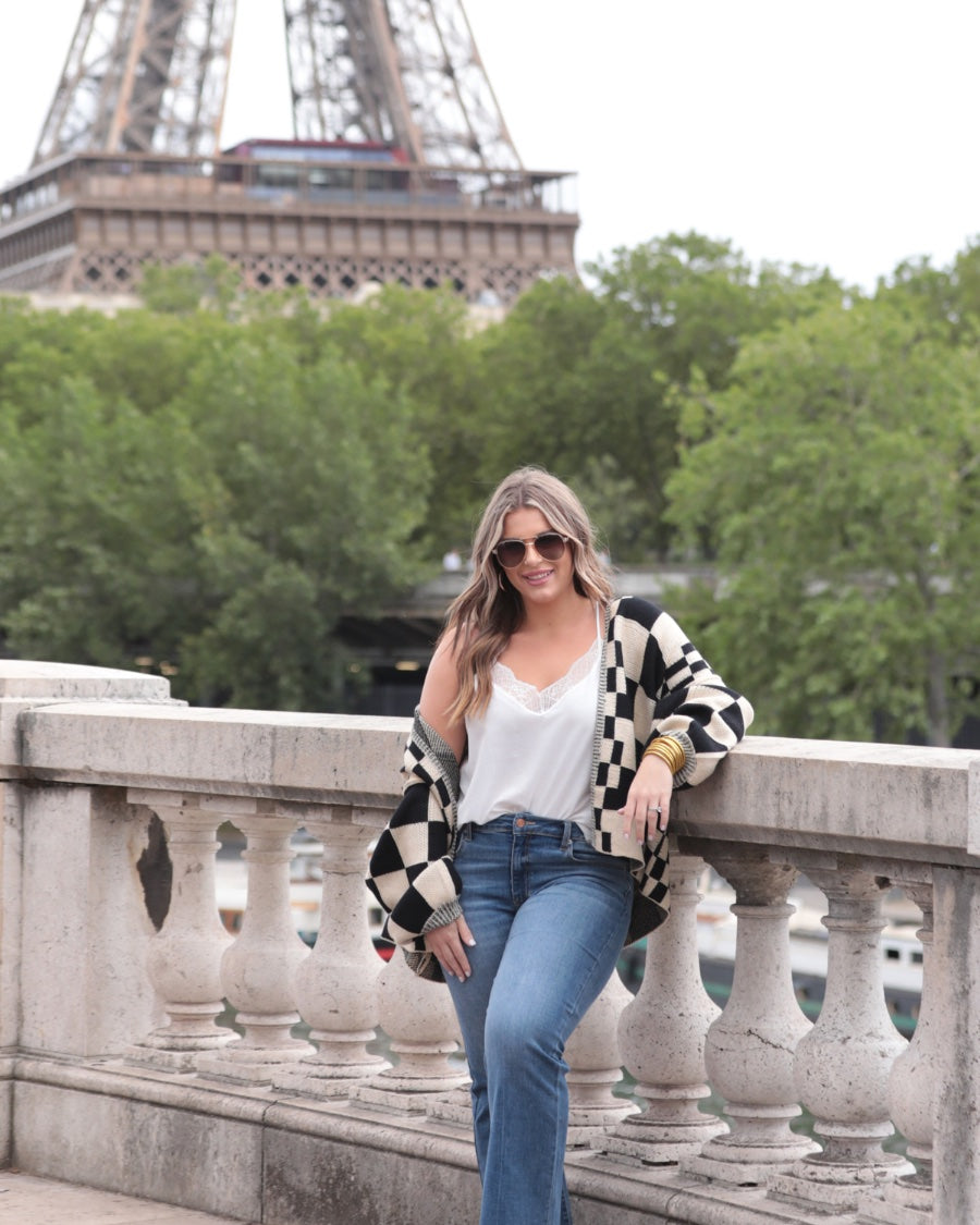 long-sleeve open front cardigan with balloon sleeves and a checkered pattern in tan/black