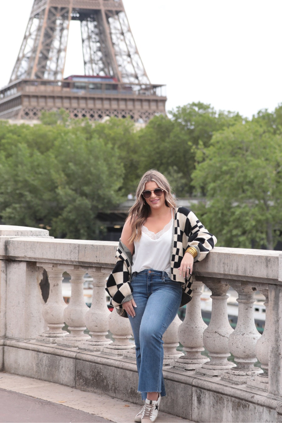 long-sleeve open front cardigan with balloon sleeves and a checkered pattern in tan/black