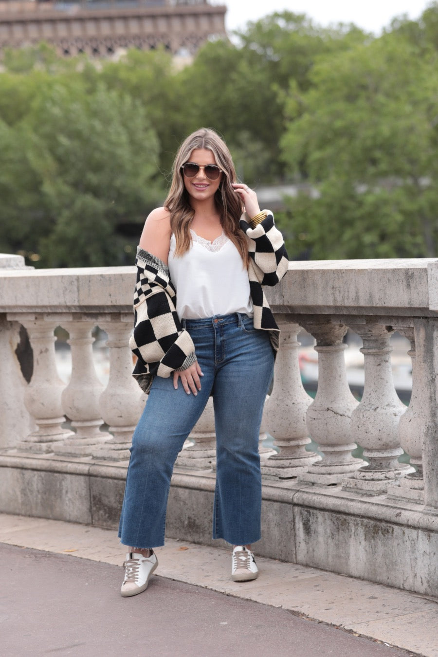 long-sleeve open front cardigan with balloon sleeves and a checkered pattern in tan/black