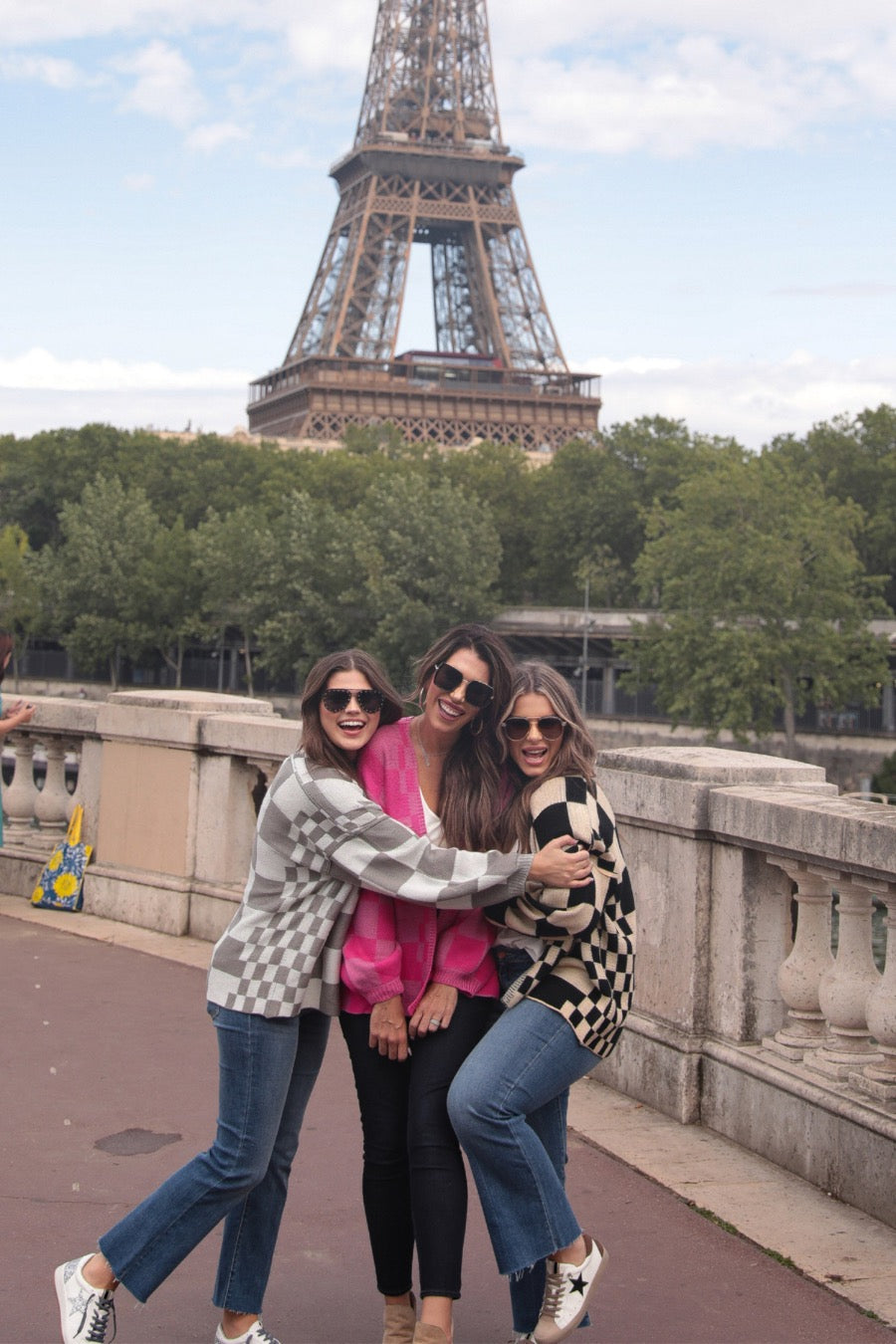 long-sleeve open front cardigan with balloon sleeves and a checkered pattern in grey/white, pink/pink, and tan/black