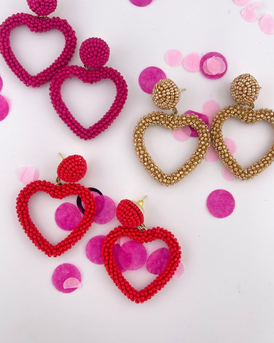 a beaded post stud with a matching beaded open heart-shape drop and a comfort earring back in gold