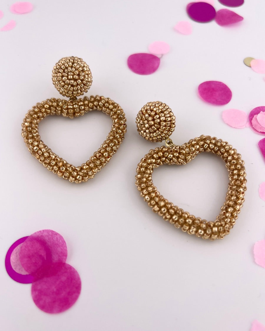 a gold beaded post stud with a matching beaded open heart-shape drop and a comfort earring back in gold