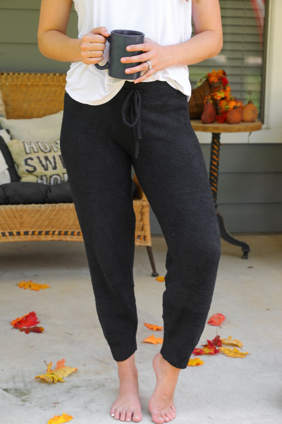 solid black joggers made from super soft fabric with an elastic waistband and a slim fit