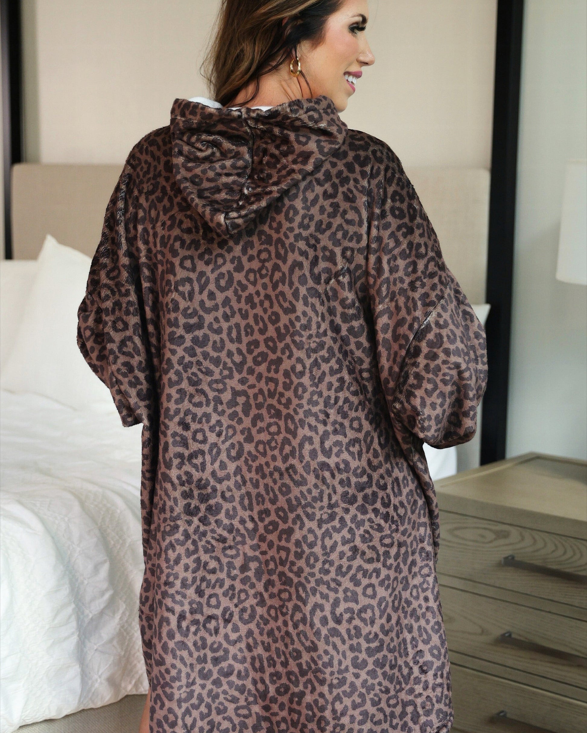 a blanket hoodie with roomy long sleeves finished with soft ribbed cuffs, a slouchy hood, drop shoulder, a kangaroo pouch on ultra plush fabric in Coco Leopard (Leopard)