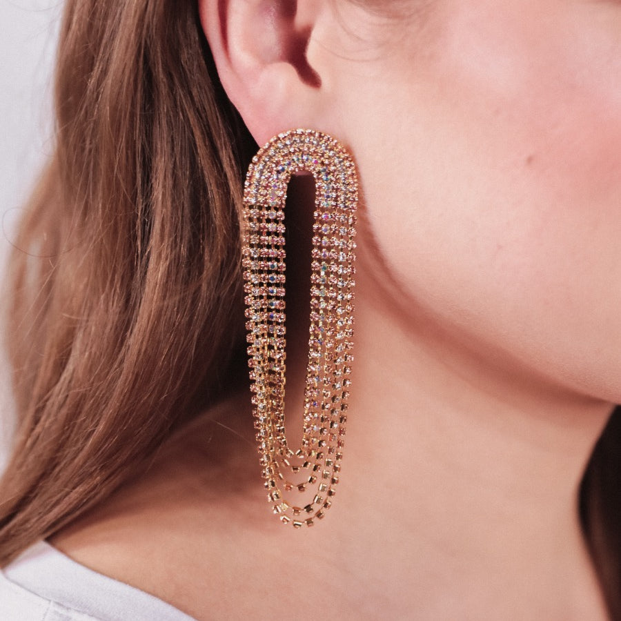 gold-plated rose gold, silver, and iridescent rhinestone stud earrings with a comfort back earring and a plastic disc stopper in gold