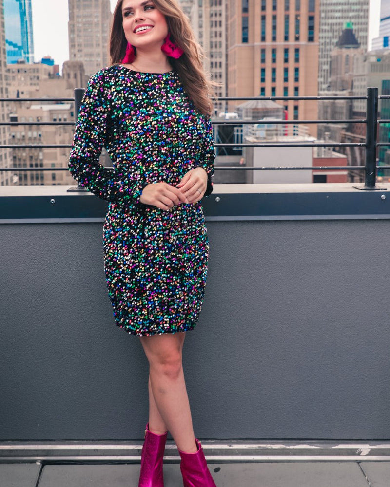 a multicolor long-sleeve dress with shimmering allover sequins detailing, a flattering silhouette, a soft-lined interior, and a back zipper that extends two-thirds down for a polished, easy fit