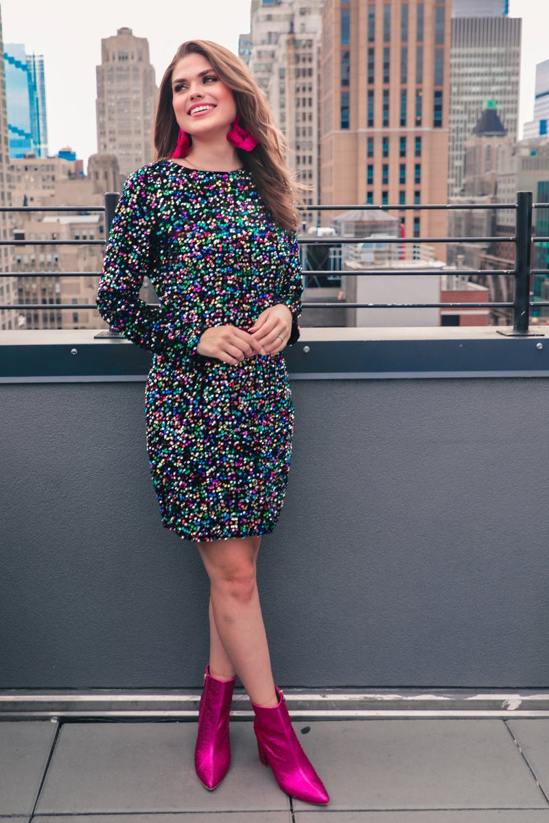 a multicolor long-sleeve dress with shimmering allover sequins detailing, a flattering silhouette, a soft-lined interior, and a back zipper that extends two-thirds down for a polished, easy fit