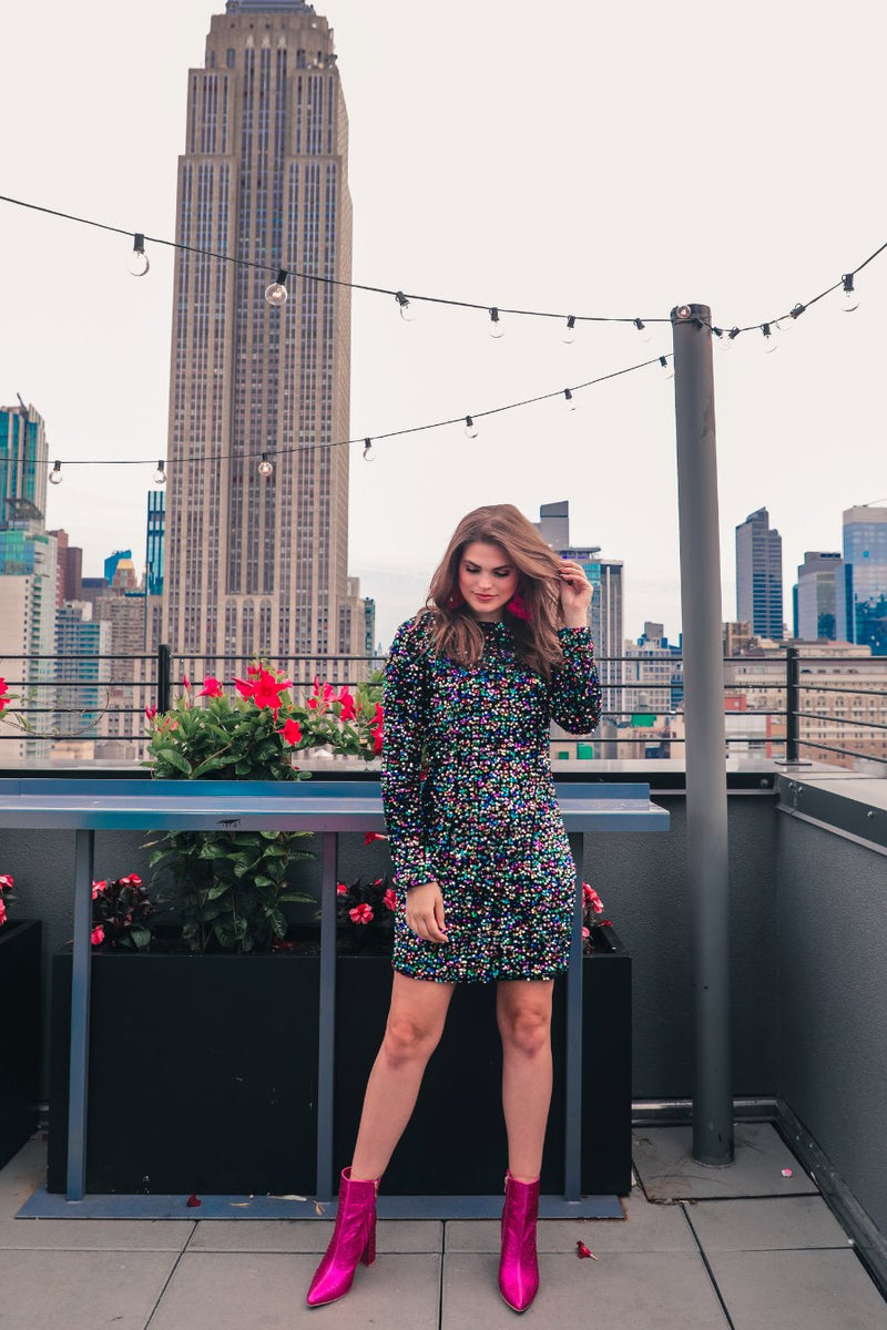 a multicolor long-sleeve dress with shimmering allover sequins detailing, a flattering silhouette, a soft-lined interior, and a back zipper that extends two-thirds down for a polished, easy fit