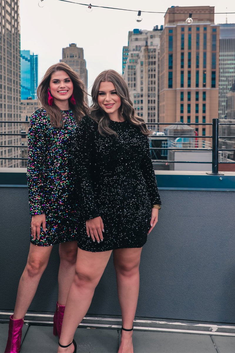 a long-sleeve dress with shimmering allover sequins detailing, a flattering silhouette, a soft-lined interior, and a back zipper that extends two-thirds down for a polished, easy fit in black and multi