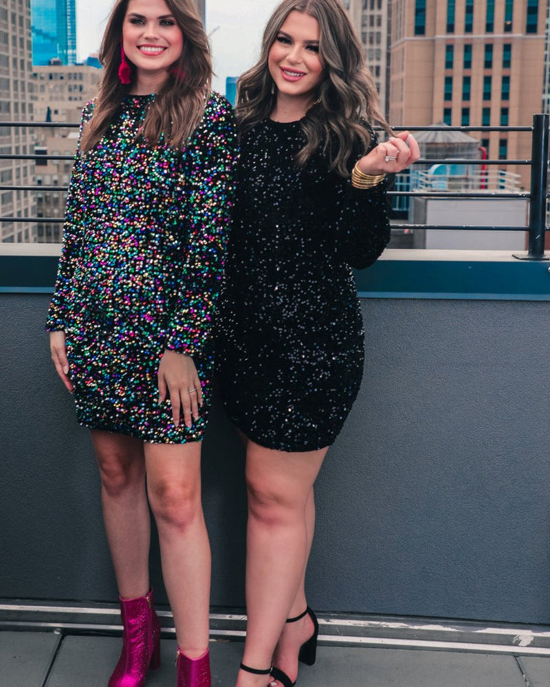 a long-sleeve dress with shimmering allover sequins detailing, a flattering silhouette, a soft-lined interior, and a back zipper that extends two-thirds down for a polished, easy fit in black and multi