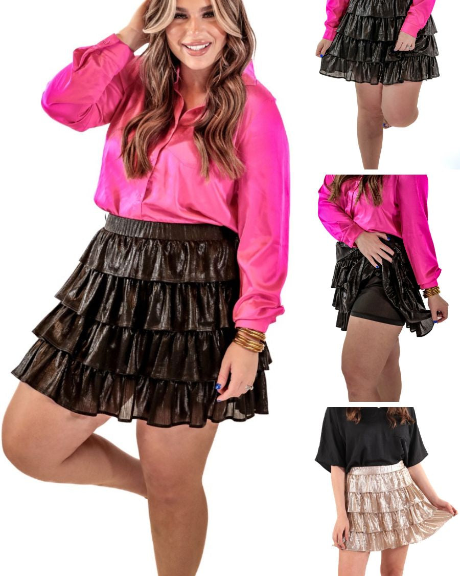 a four-tiered design skort with built-in shorts and an elastic waistband on a metallic fabric in black and gold