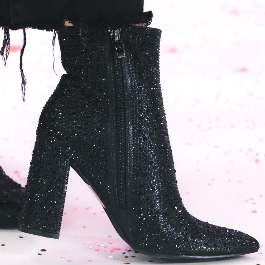 rhinestone-covered booties with a pointed toe, front seam, inside zipper, cushioned flatbed, and a 4" block heel in black