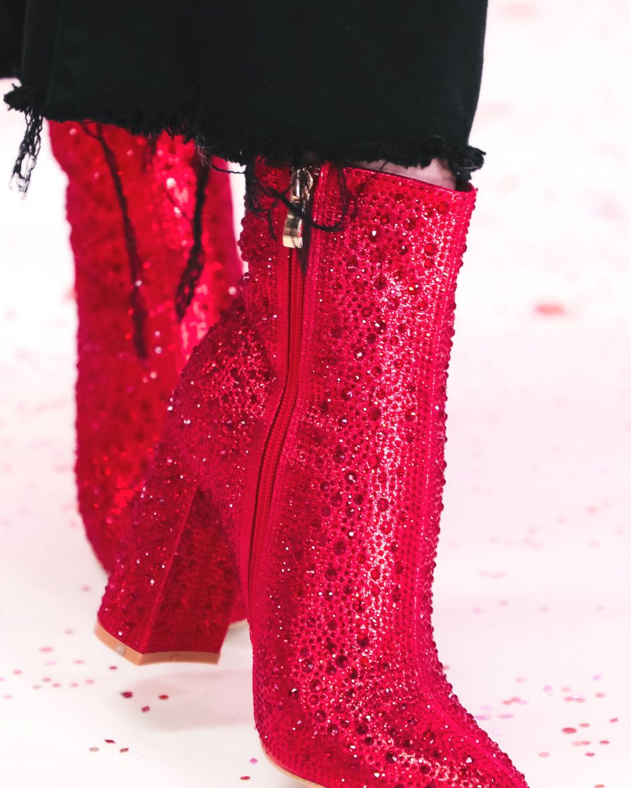 rhinestone-covered booties with a pointed toe, front seam, inside zipper, cushioned flatbed, and a 4" block heel in red