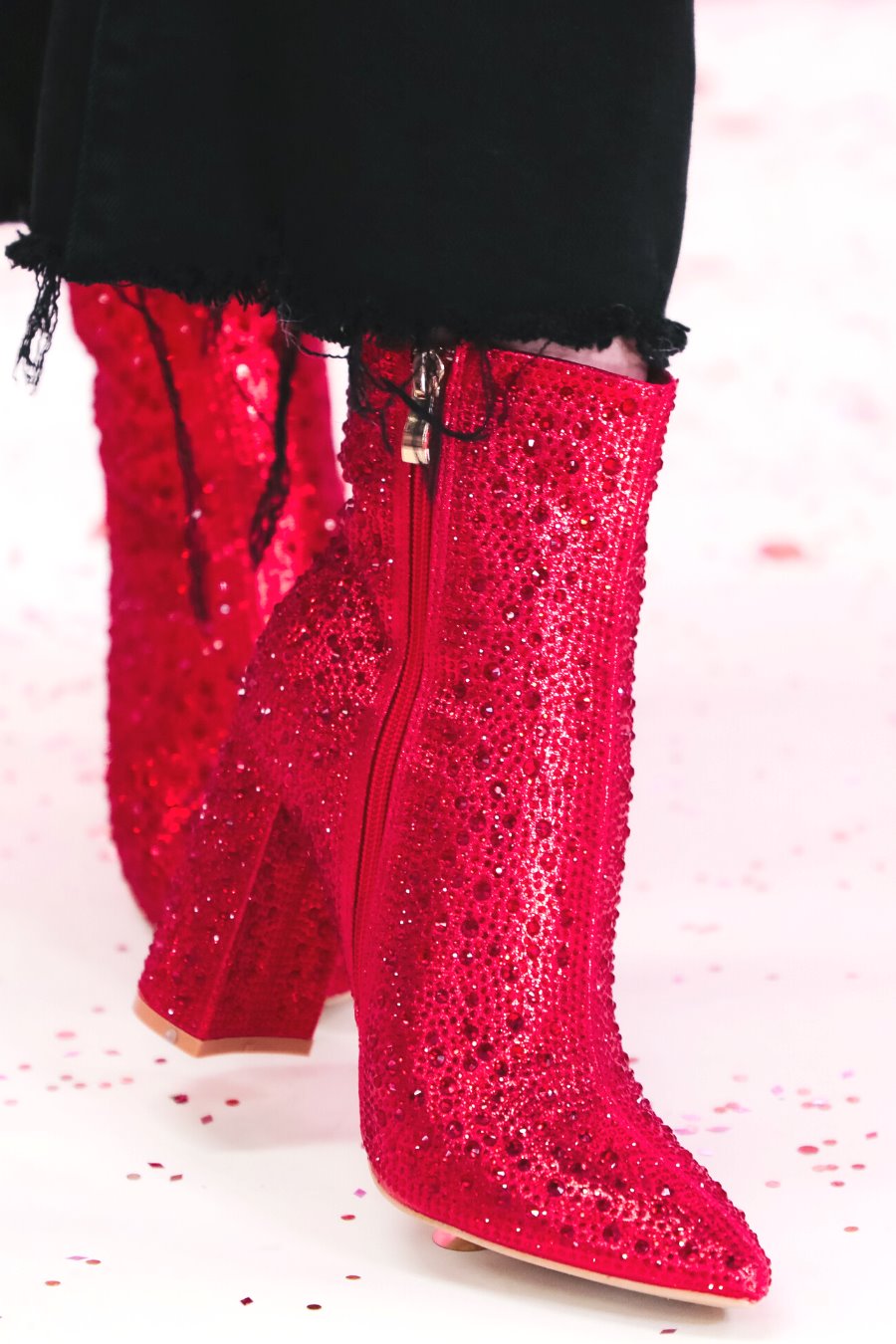rhinestone-covered booties with a pointed toe, front seam, inside zipper, cushioned flatbed, and a 4" block heel in red