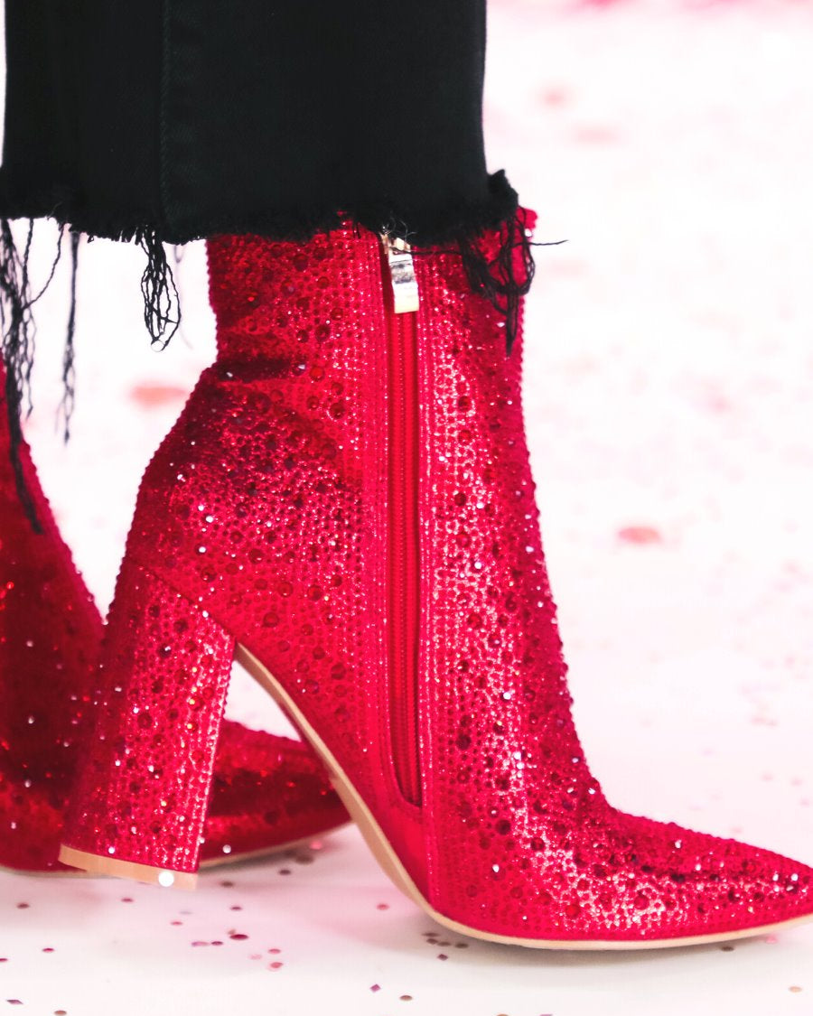 rhinestone-covered booties with a pointed toe, front seam, inside zipper, cushioned flatbed, and a 4" block heel in red