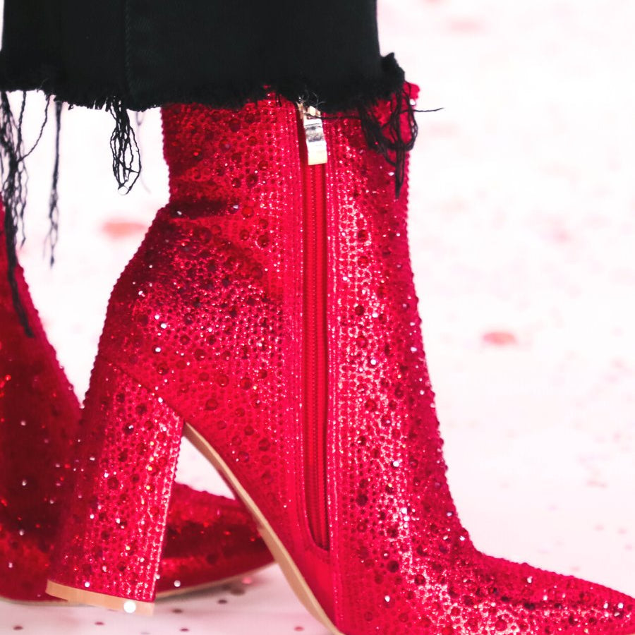 rhinestone-covered booties with a pointed toe, front seam, inside zipper, cushioned flatbed, and a 4" block heel in red