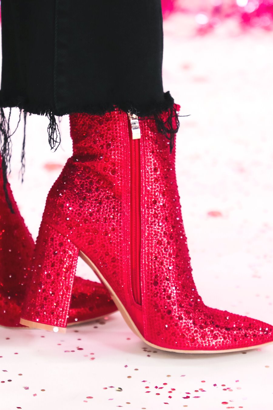 rhinestone-covered booties with a pointed toe, front seam, inside zipper, cushioned flatbed, and a 4" block heel in red