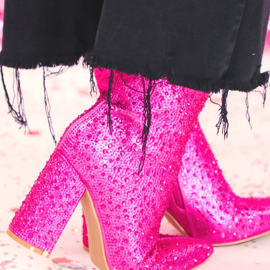 rhinestone-covered booties with a pointed toe, front seam, inside zipper, cushioned flatbed, and a 4" block heel in pink