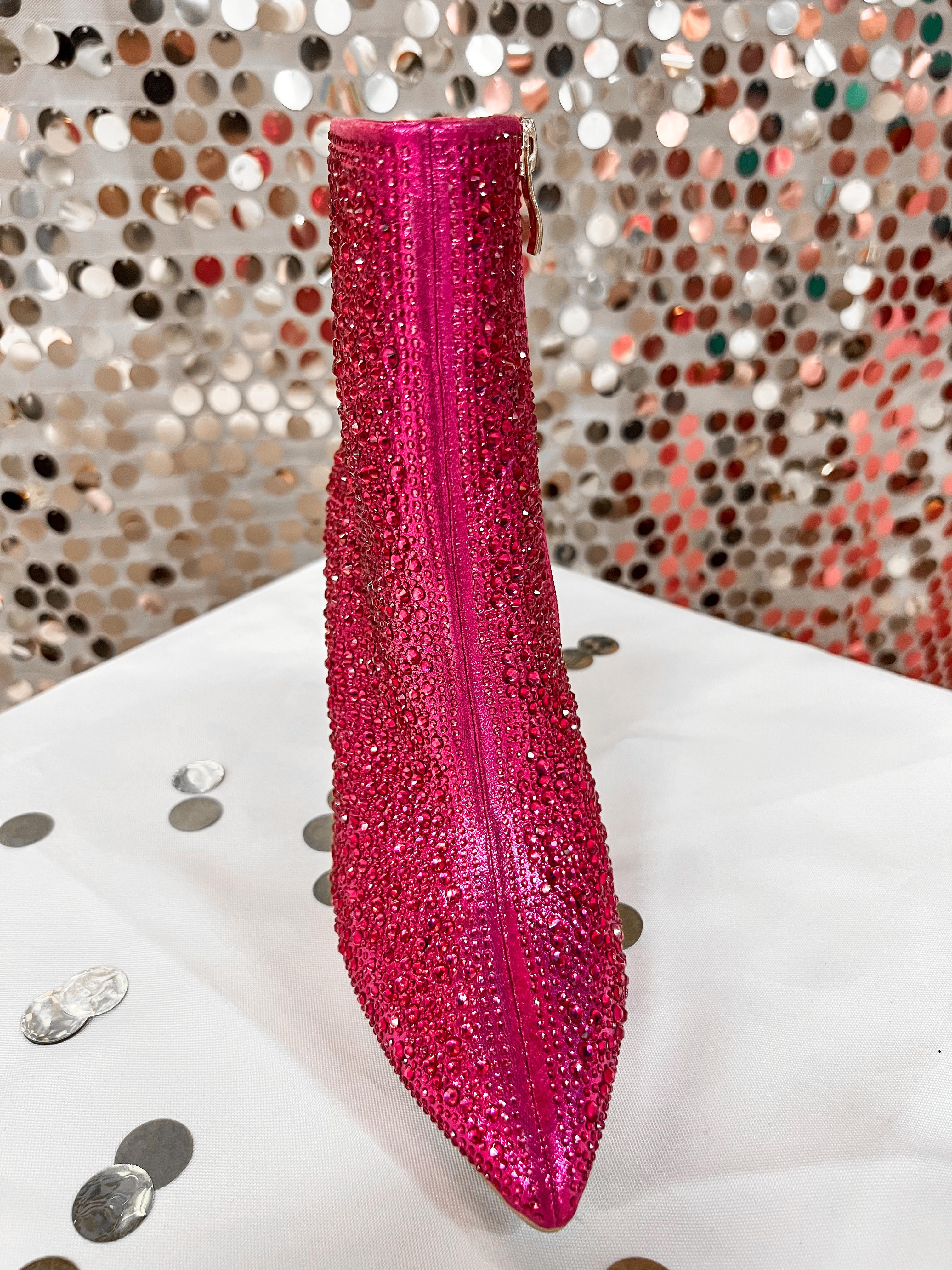 rhinestone-covered booties with a pointed toe, front seam, inside zipper, cushioned flatbed, and a 4" block heel in pink