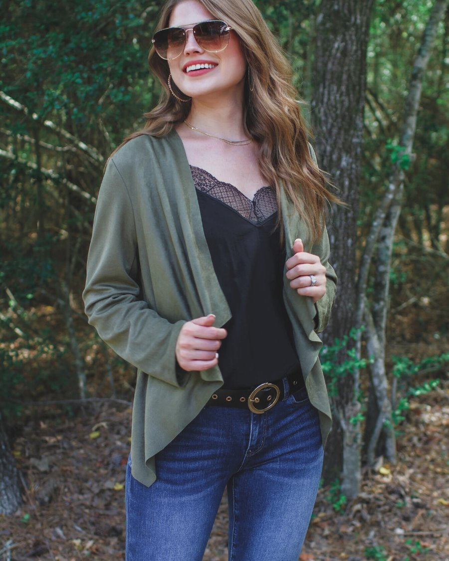 draped open-front silhouette jacket, crafted on a super soft faux suede material with long sleeves, an angled front cropped hem, and subtle seam details on the back in olive