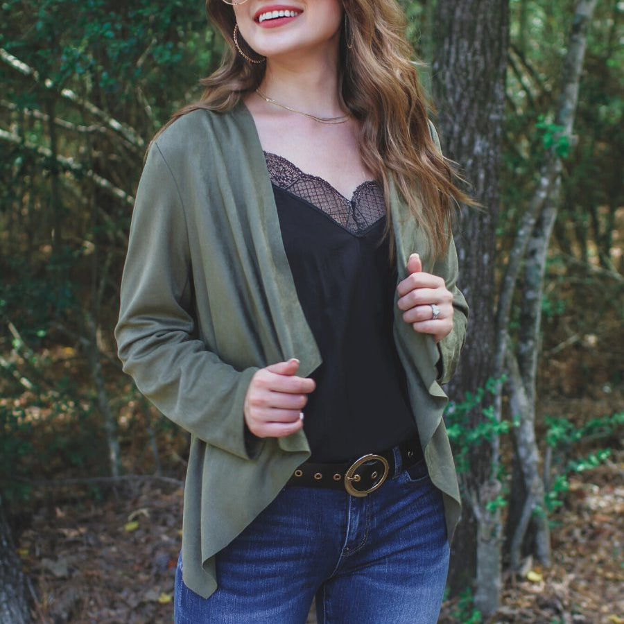 draped open-front silhouette jacket, crafted on a super soft faux suede material with long sleeves, an angled front cropped hem, and subtle seam details on the back in olive