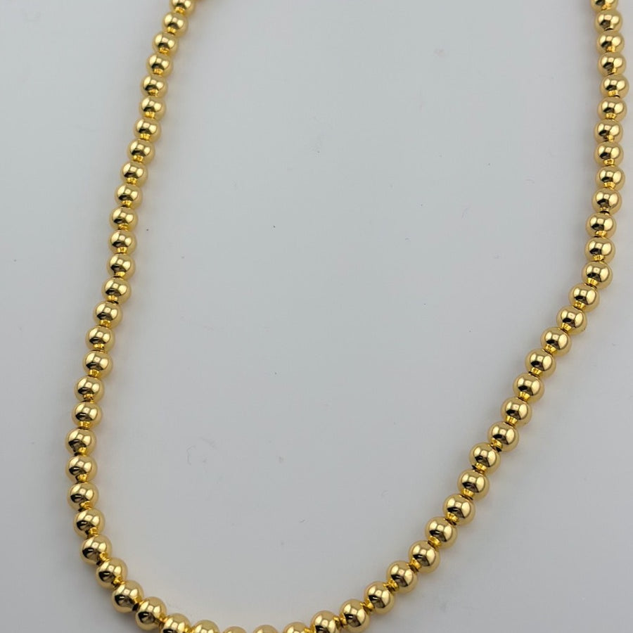 a gold-plated necklace with 6mm brass beads