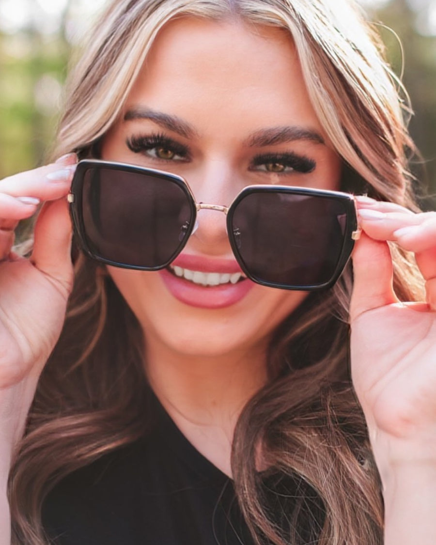 black square frame sunglasses with gold bridge, nose pads, UV protection, and brand name detail (on both the temple and the complimentary black pouch)