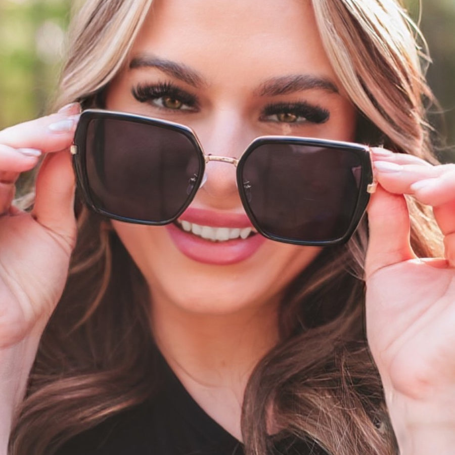 black square frame sunglasses with gold bridge, nose pads, UV protection, and brand name detail (on both the temple and the complimentary black pouch)