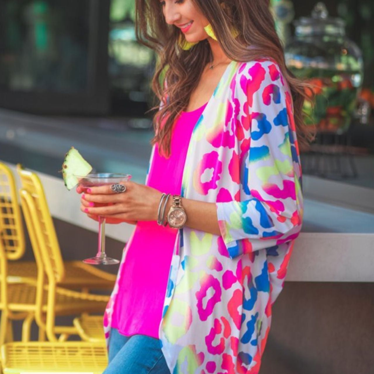 MADE IN USA three-quarter sleeve open front cardigan made of lightweight material that drapes into a cocoon shape on a vibrant leopard print pattern fabric in white