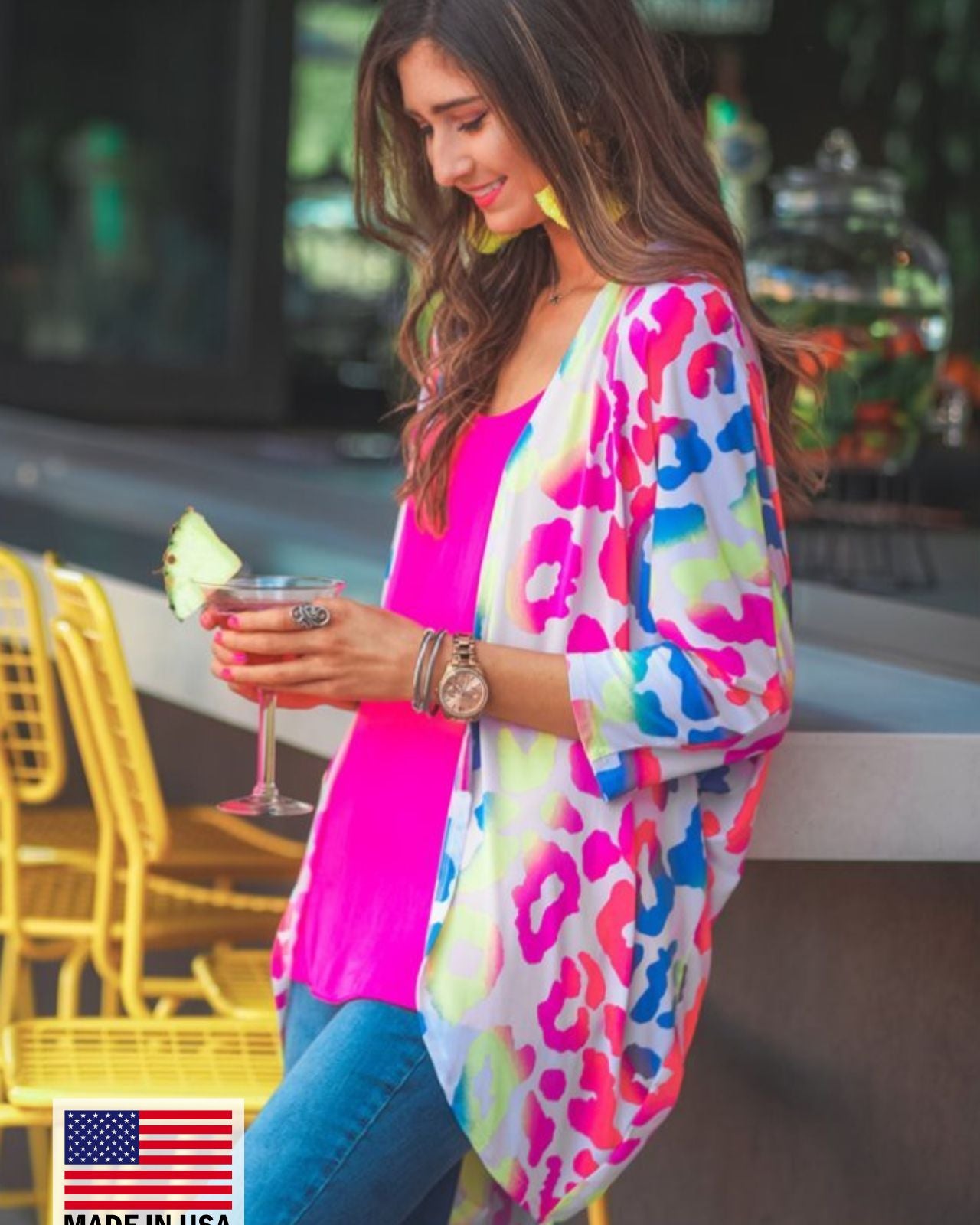 MADE IN USA three-quarter sleeve open front cardigan made of lightweight material that drapes into a cocoon shape on a vibrant leopard print pattern fabric in white