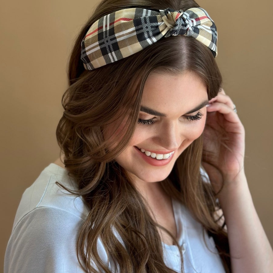 top knot headband crafted from soft, lightweight material with a classic autumn hue plaid on a tan base