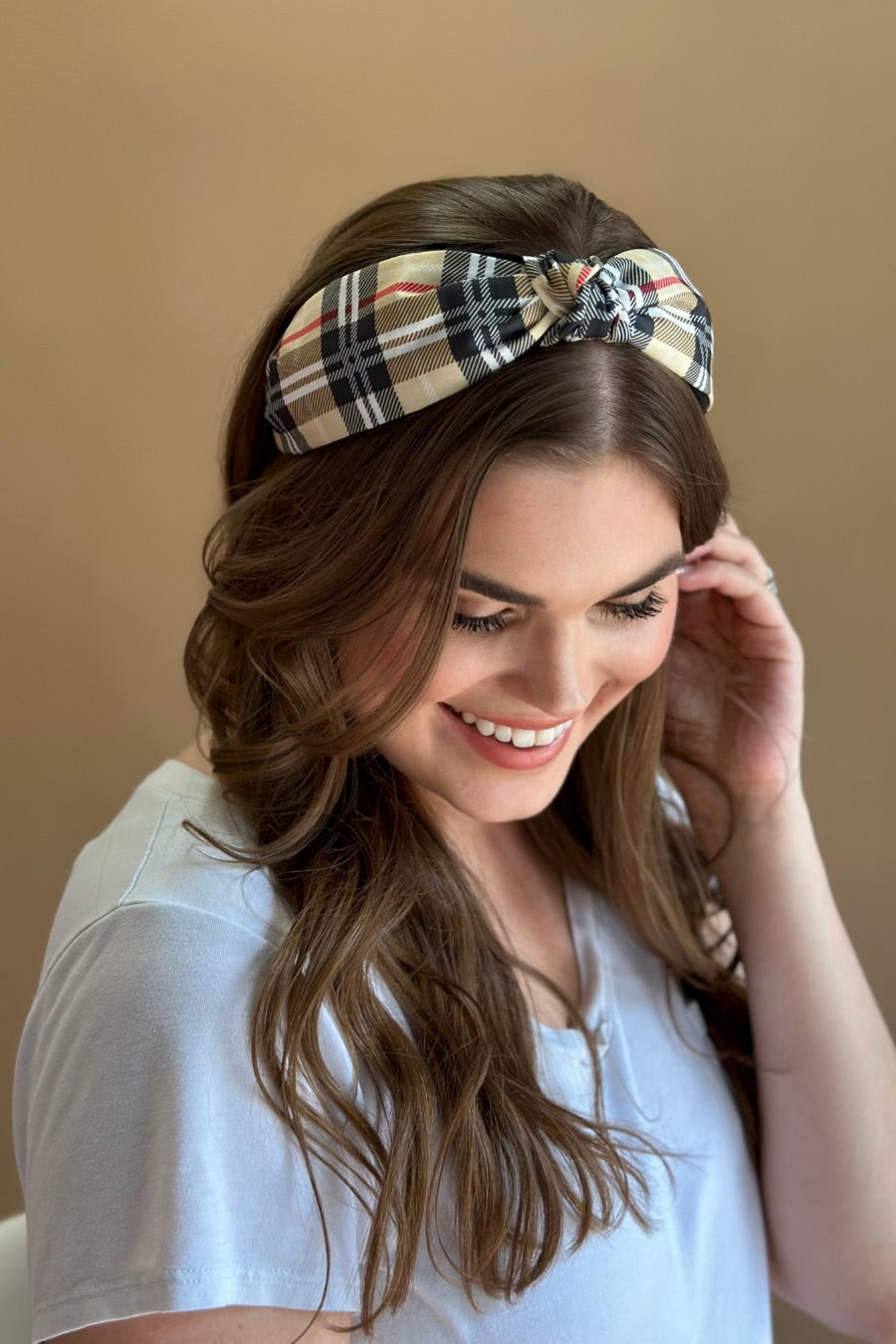 top knot headband crafted from soft, lightweight material with a classic autumn hue plaid on a tan base