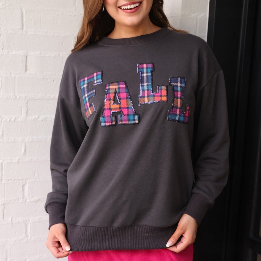 long-sleeve gray pullover with plaid 'FALL' letters in our exclusive Patterned In Plaid print, each outlined in sequins on a soft, cozy fabric