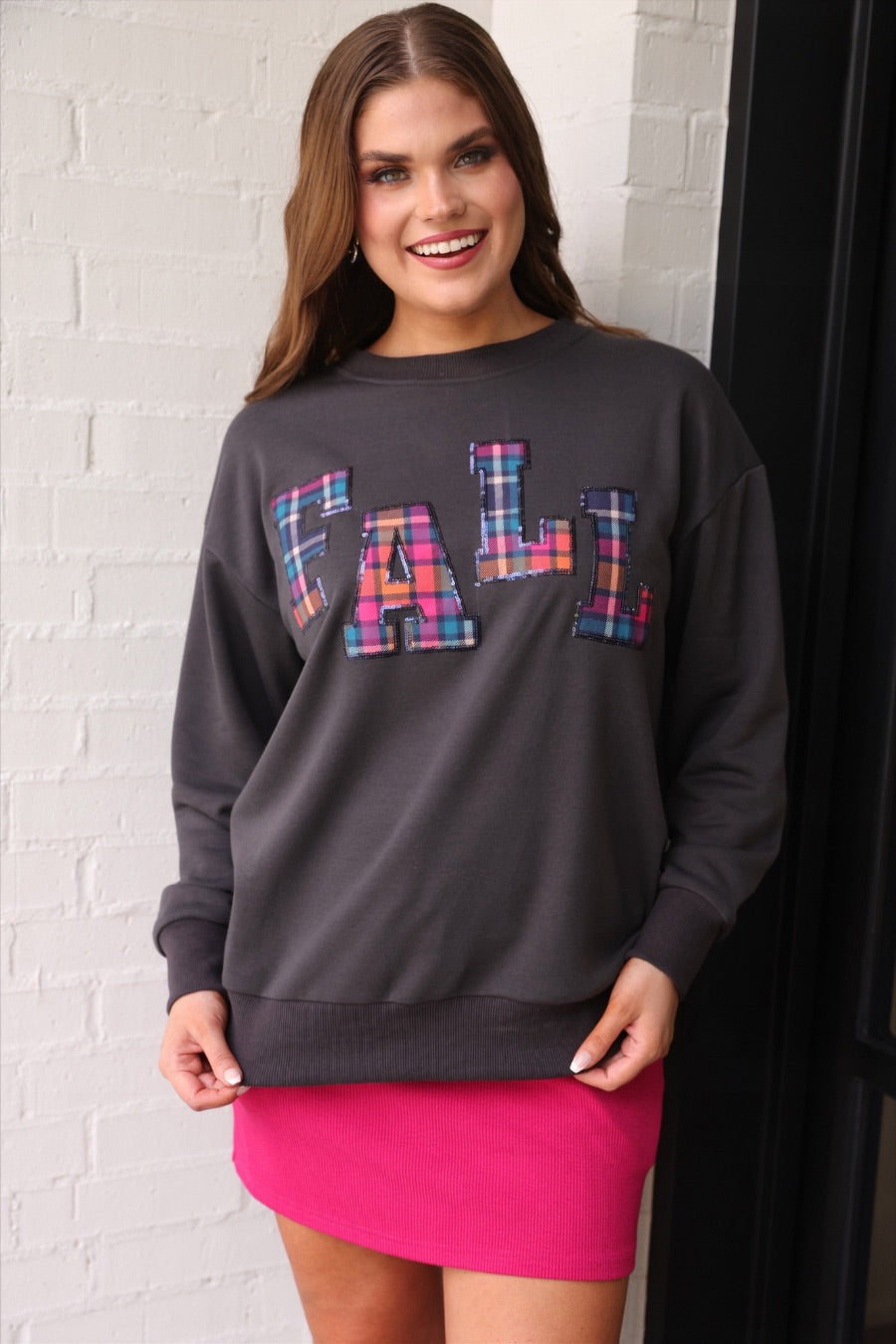 long-sleeve gray pullover with plaid 'FALL' letters in our exclusive Patterned In Plaid print, each outlined in sequins on a soft, cozy fabric