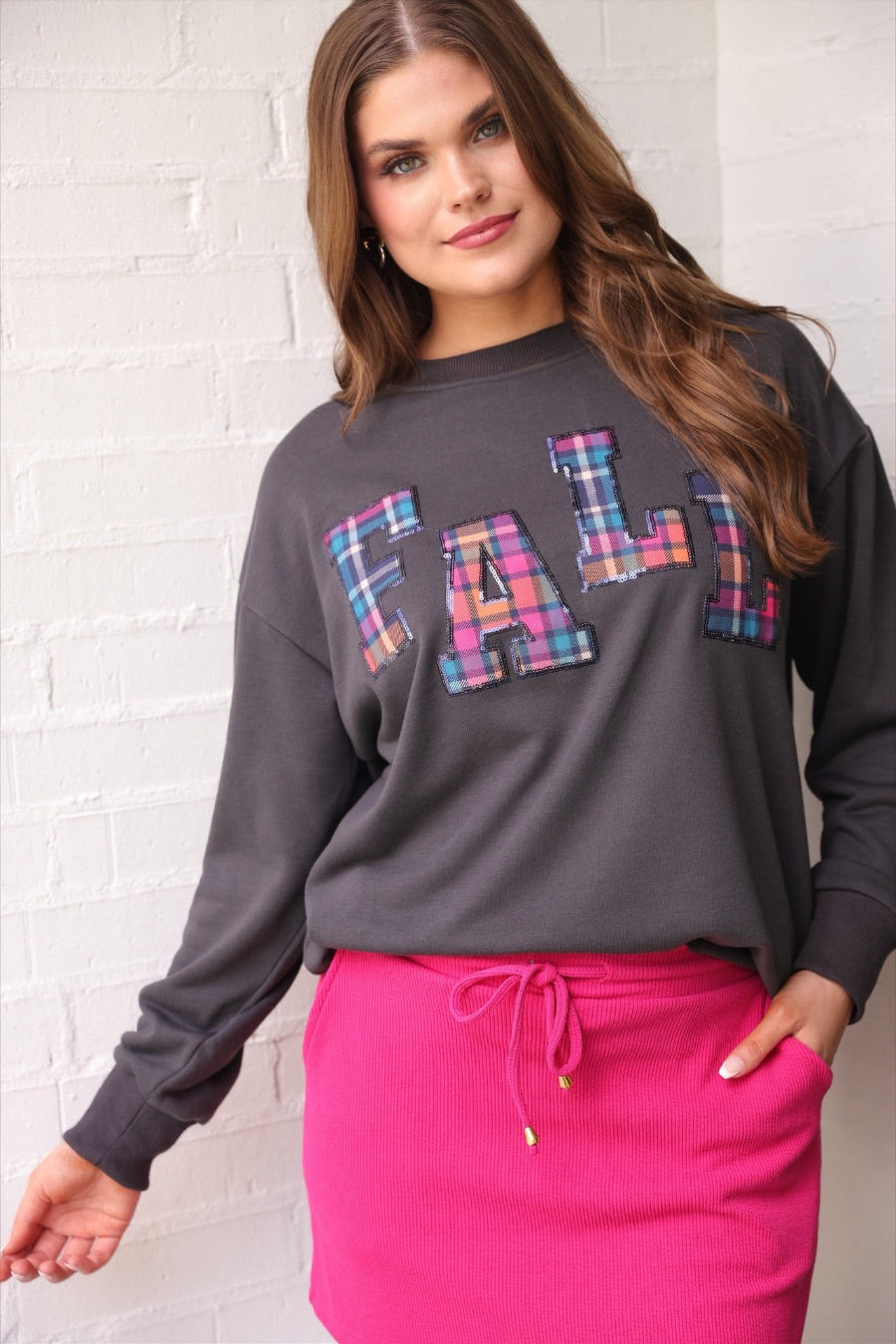 long-sleeve gray pullover with plaid 'FALL' letters in our exclusive Patterned In Plaid print, each outlined in sequins on a soft, cozy fabric