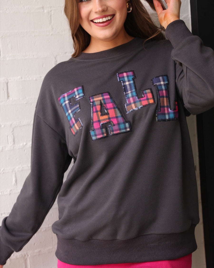 long-sleeve gray pullover with plaid 'FALL' letters in our exclusive Patterned In Plaid print, each outlined in sequins on a soft, cozy fabric