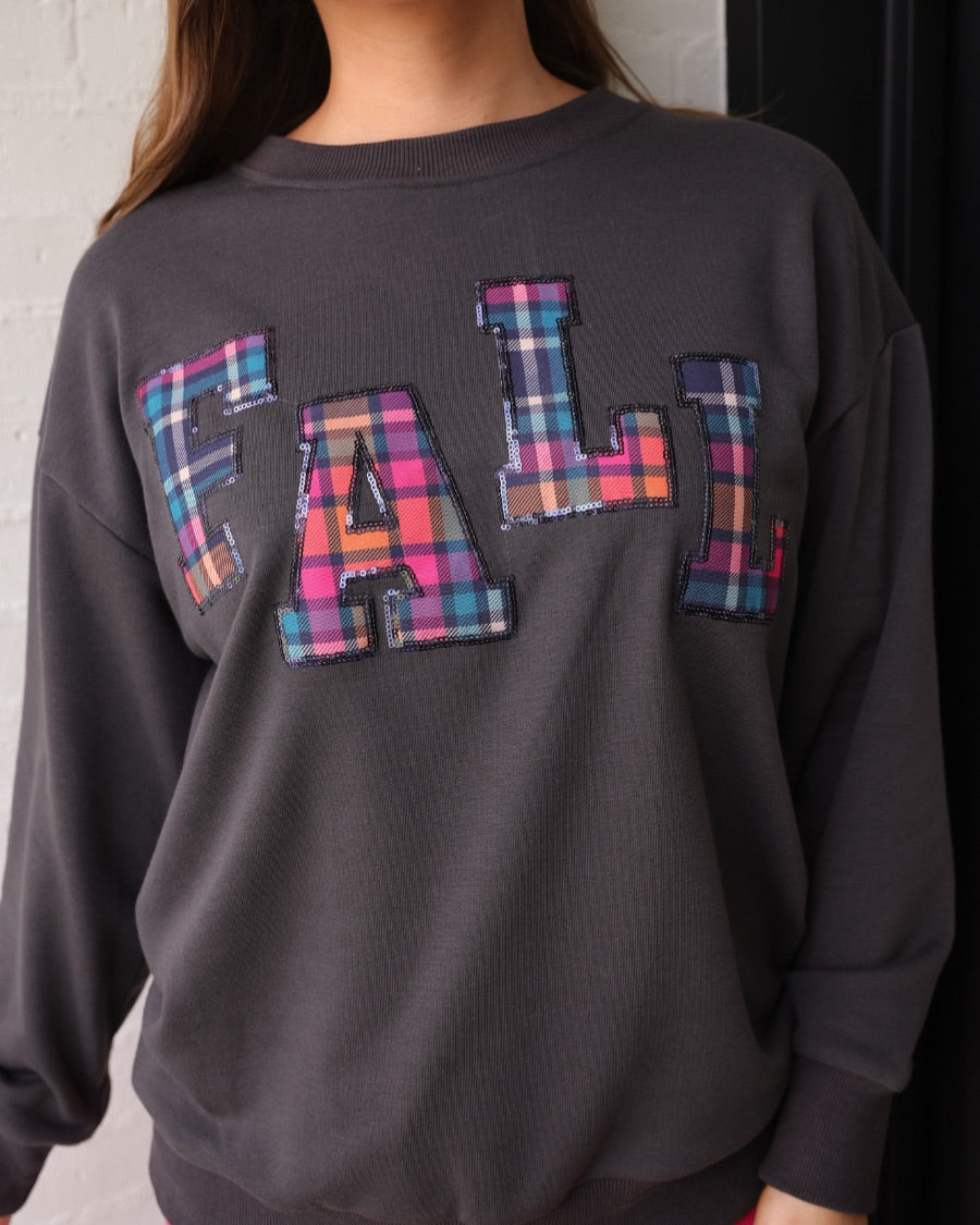 long-sleeve gray pullover with plaid 'FALL' letters in our exclusive Patterned In Plaid print, each outlined in sequins on a soft, cozy fabric