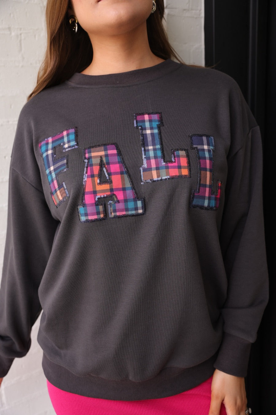 long-sleeve gray pullover with plaid 'FALL' letters in our exclusive Patterned In Plaid print, each outlined in sequins on a soft, cozy fabric