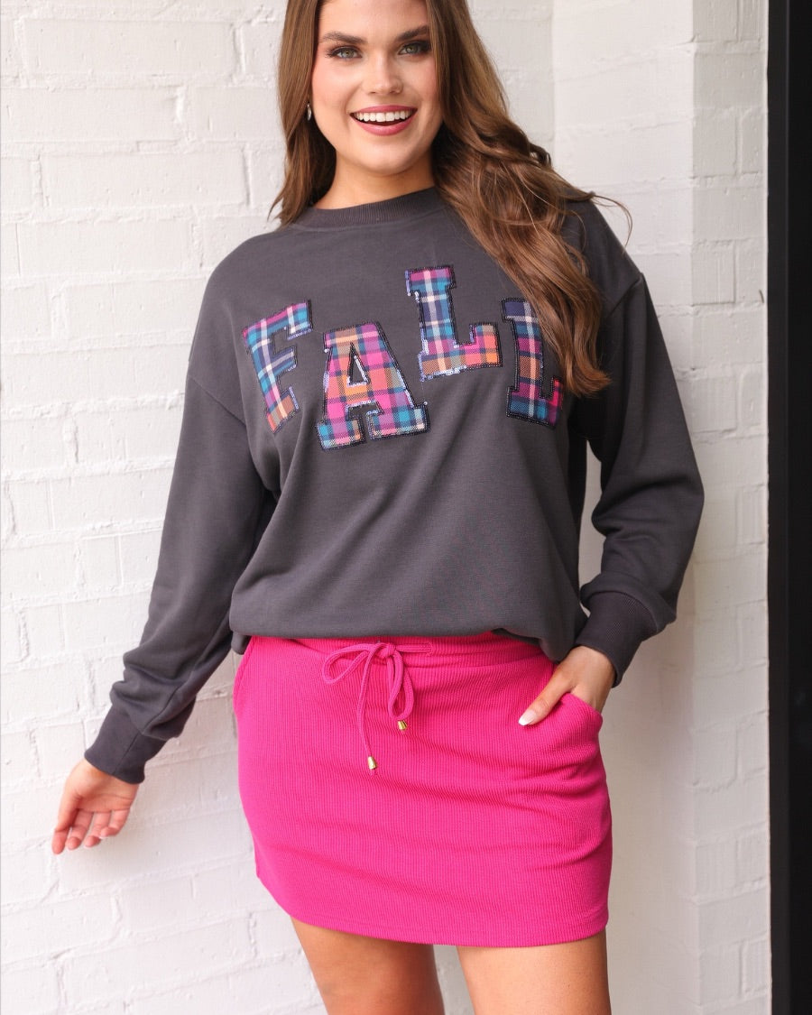 long-sleeve gray pullover with plaid 'FALL' letters in our exclusive Patterned In Plaid print, each outlined in sequins on a soft, cozy fabric