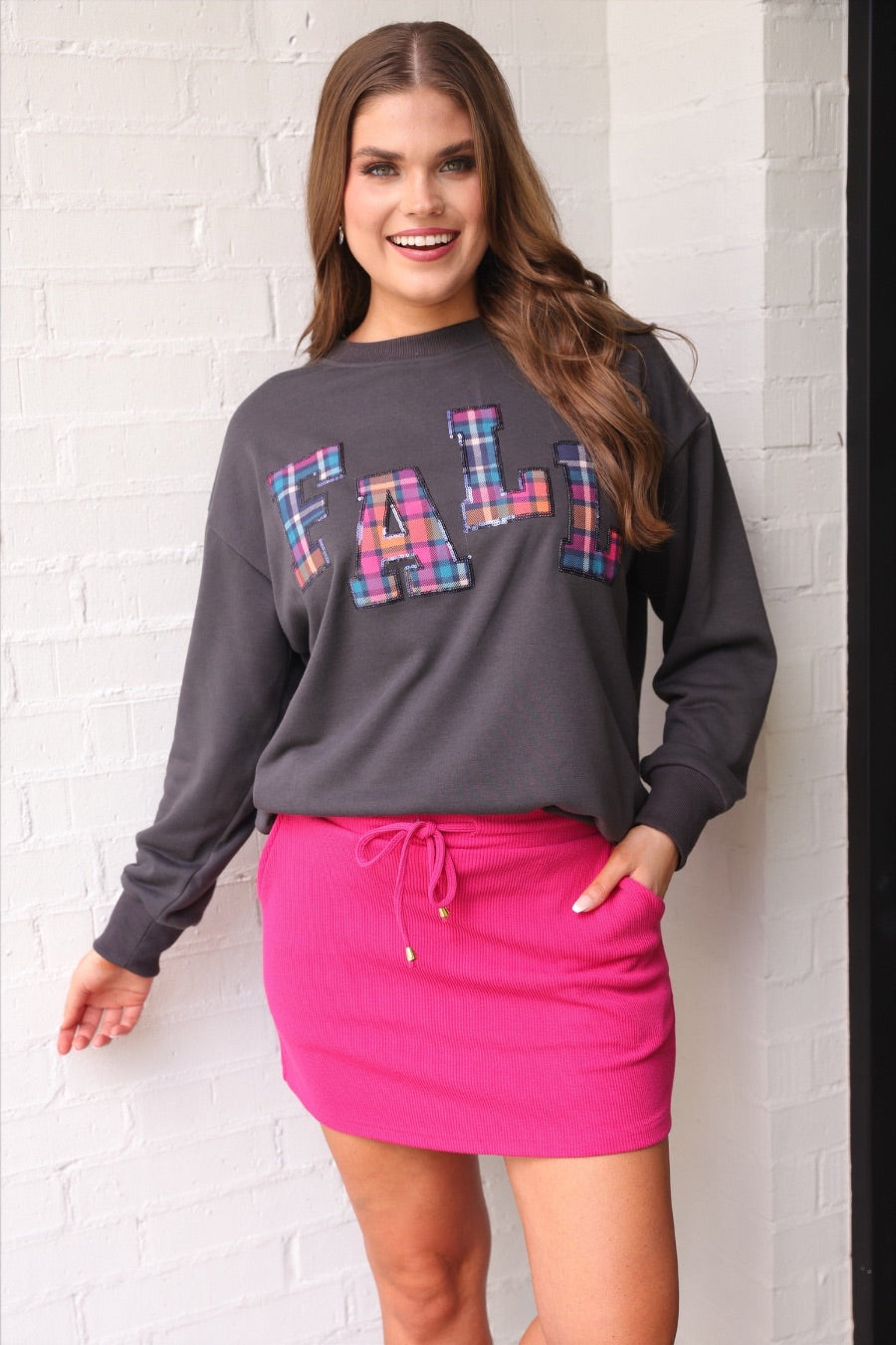 long-sleeve gray pullover with plaid 'FALL' letters in our exclusive Patterned In Plaid print, each outlined in sequins on a soft, cozy fabric