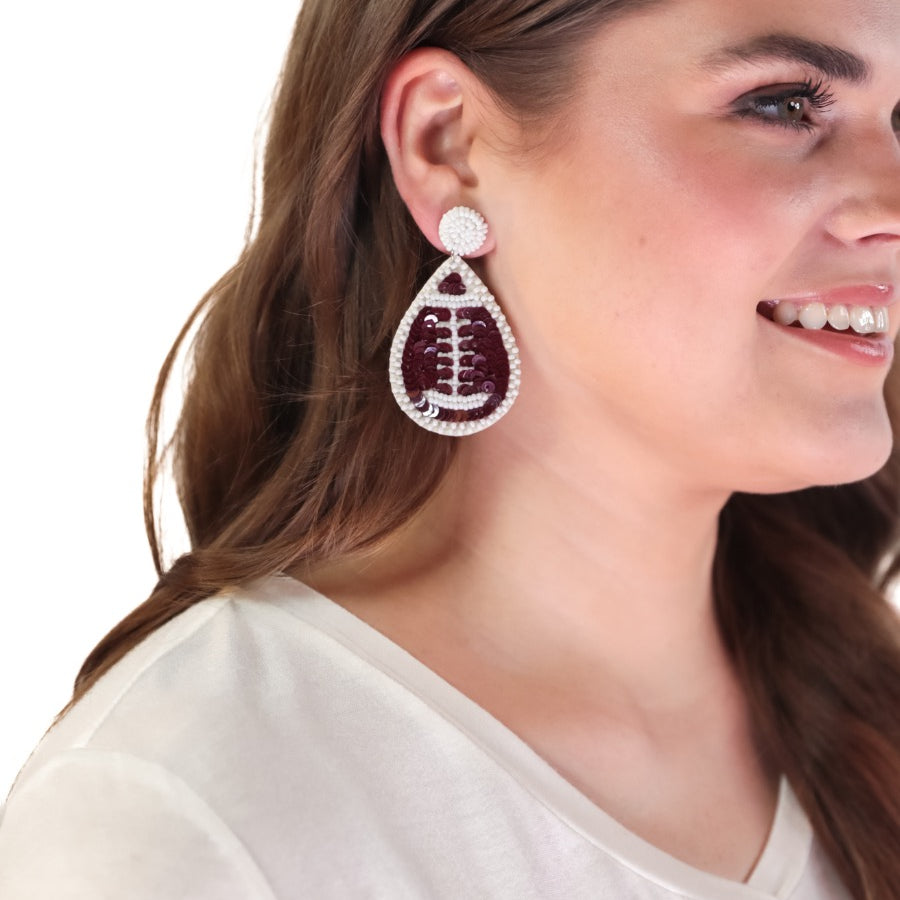 lightweight, sports-inspired beaded teardrop-shaped earrings with a felt backing, a comfort back, and a plastic disc stopper in gold that's nickel and lead compliant in football (brown)