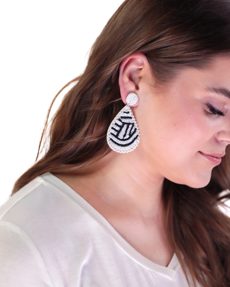 lightweight, sports-inspired beaded teardrop-shaped earrings with a felt backing, a comfort back, and a plastic disc stopper in gold that's nickel and lead compliant in volleyball (white)