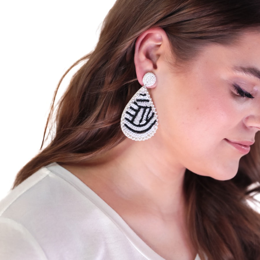 lightweight, sports-inspired beaded teardrop-shaped earrings with a felt backing, a comfort back, and a plastic disc stopper in gold that's nickel and lead compliant in volleyball (white)