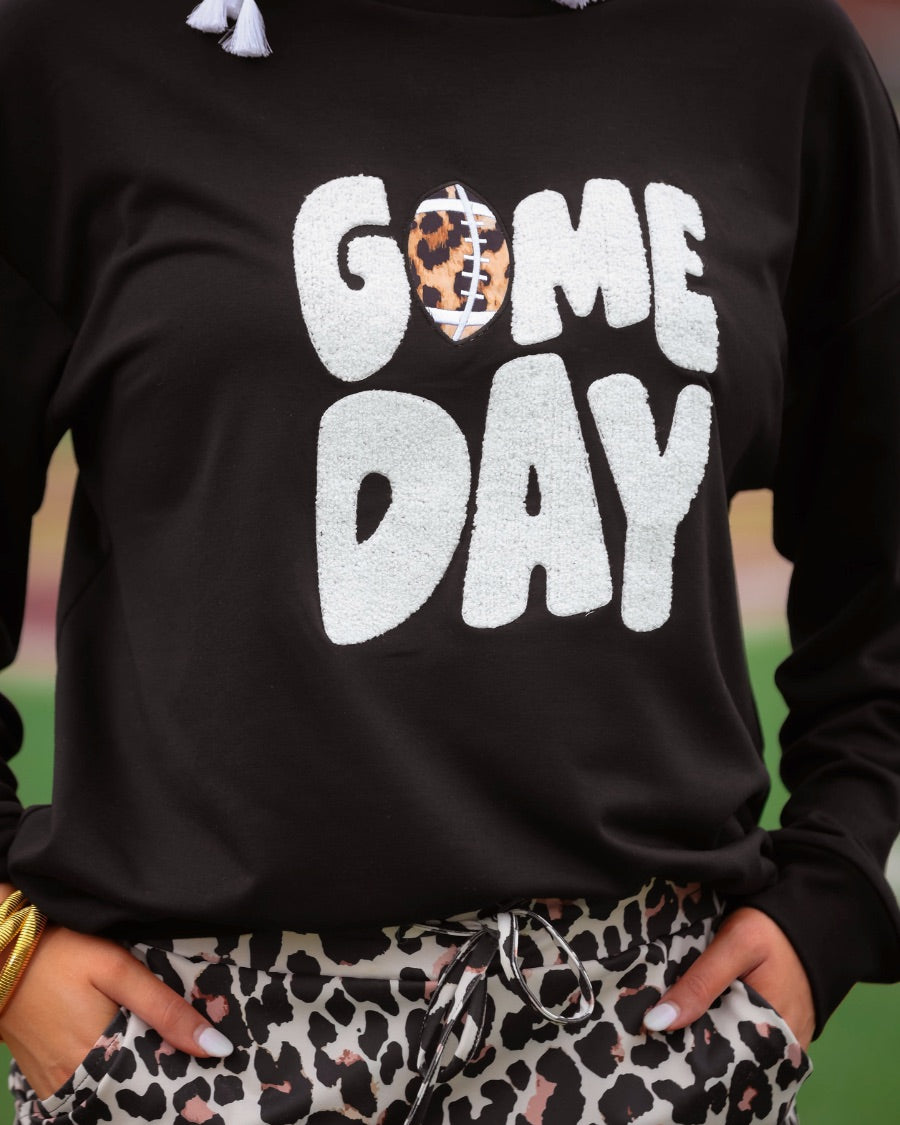 a black long-sleeve sweatshirt with standout "Game Day" chenille patch lettering in white and a leopard football detail as the A on an ultra-soft, midweight fabric