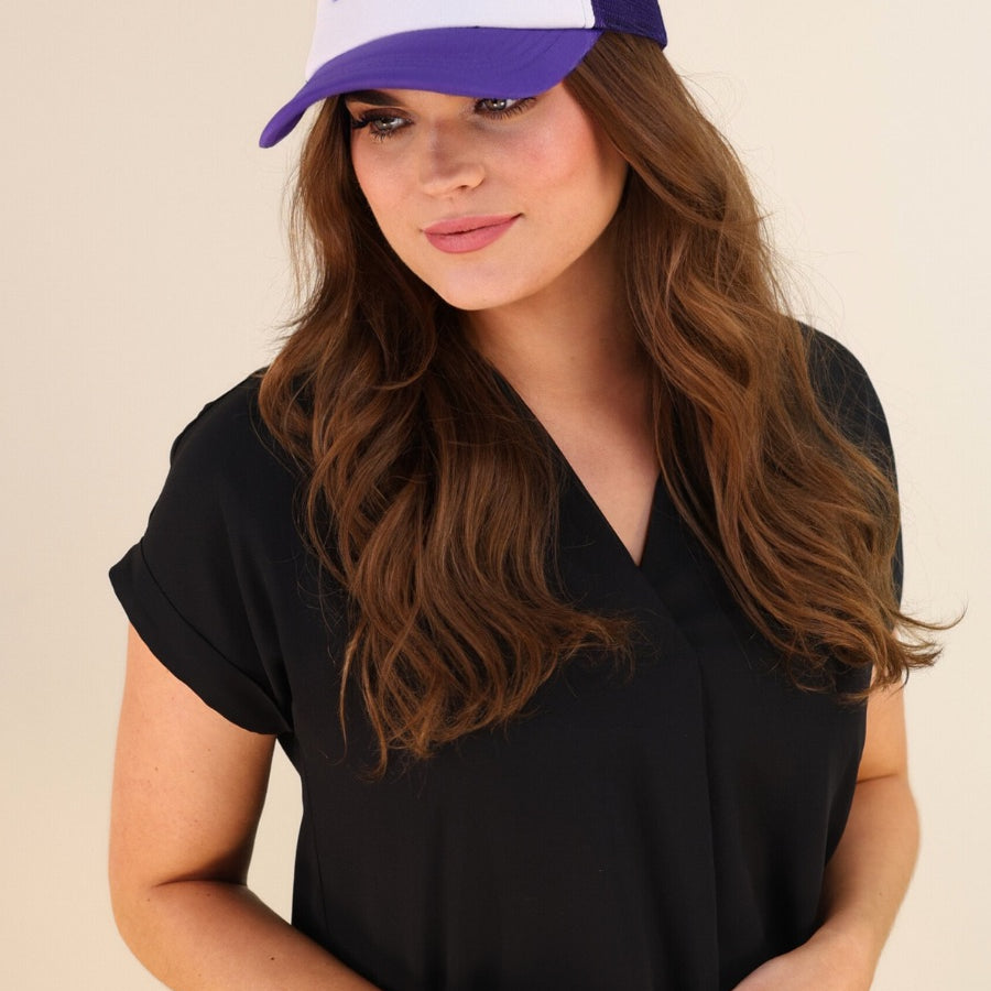 a lightweight purple two-tone trucker hat with raised embroidered 'GAME DAY' lettering, tall foam front panel, breathable mesh back, snapback closure, and a curved bill