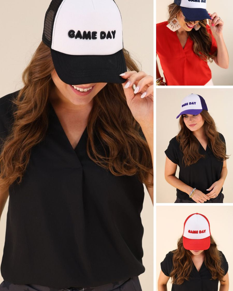 lightweight two-tone trucker hats with raised embroidered 'GAME DAY' lettering, tall foam front panel, breathable mesh back, snapback closure, and a curved bill in black, navy, purple, and red
