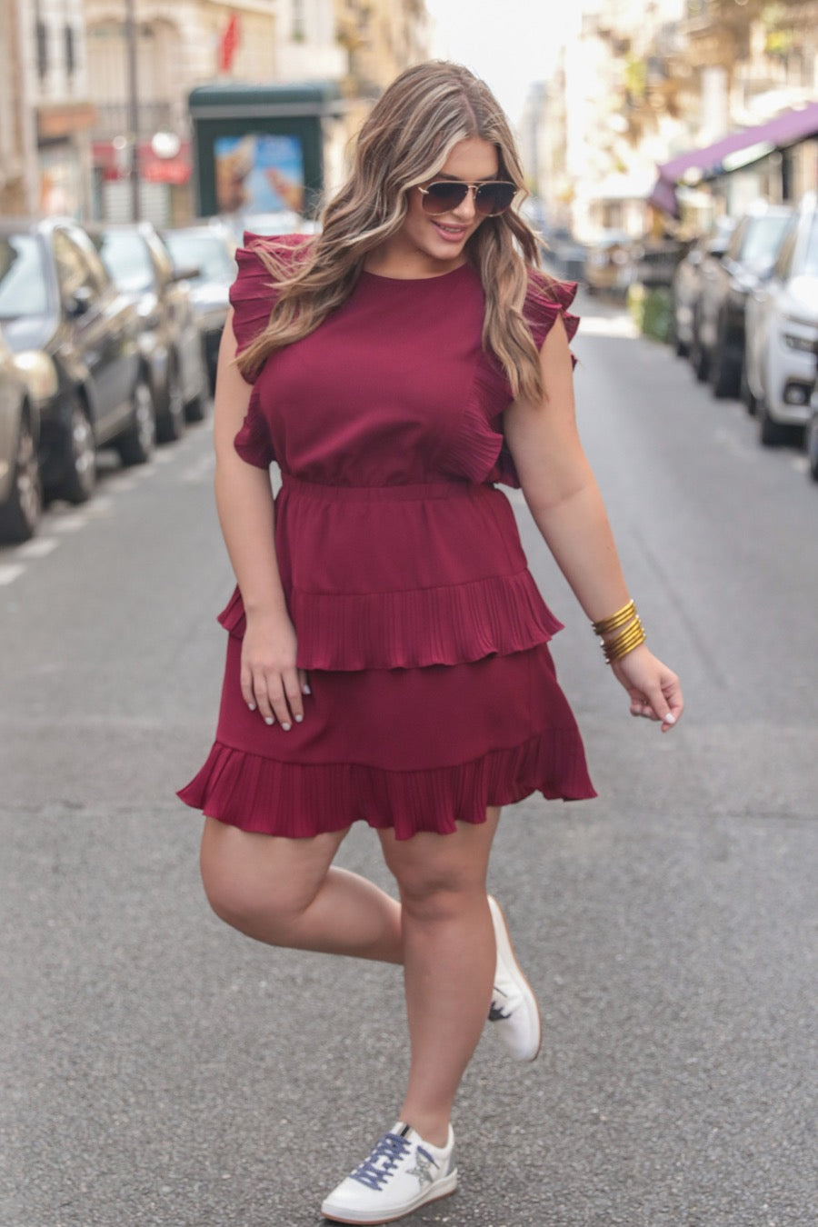 ruffled sleeve dress with layered pleats, an elastic waistband, and a lined bottom in burgundy